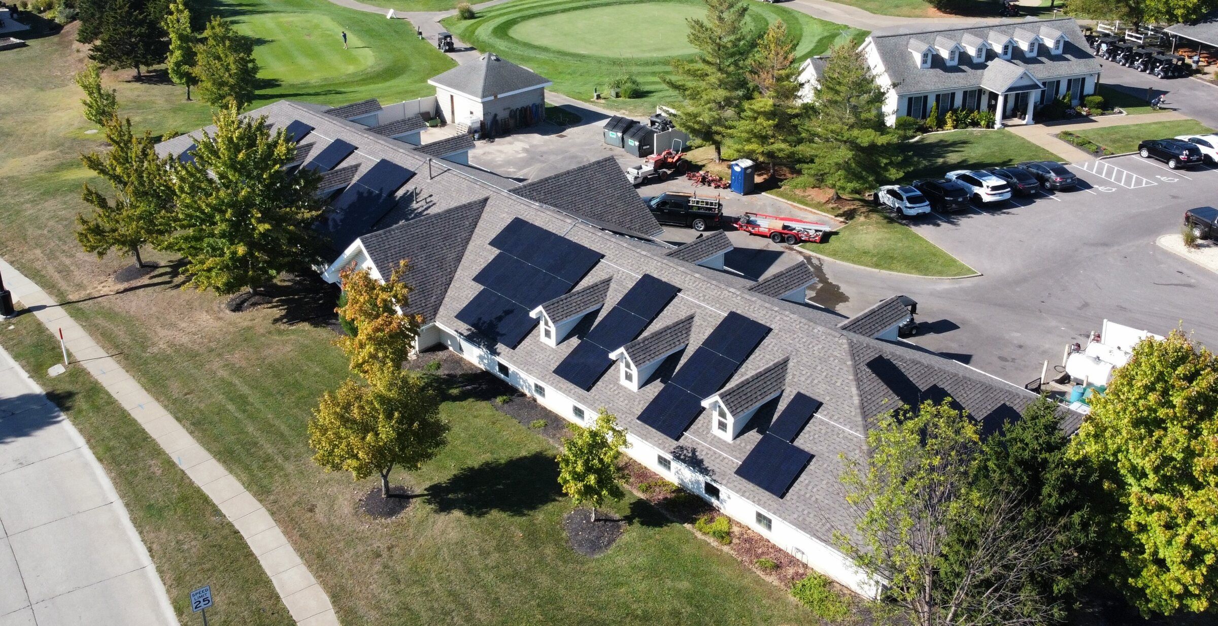 Aerial view of the Golf Club at Wentzville clubhouse with solar panels on its roof