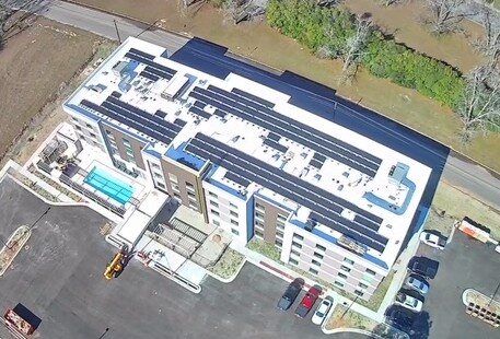 Home2 Suites hotel in Tifton, Georgia with solar across its flat roof