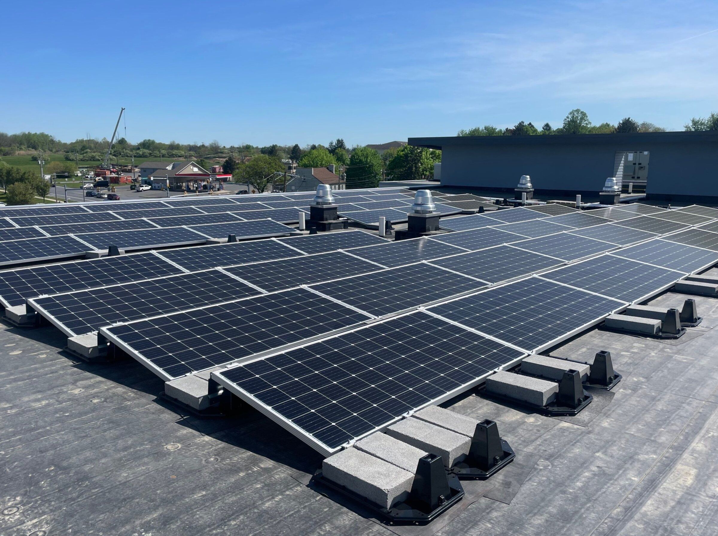 Close view of ballasted solar panels on the flat roof of TownePlace Suites in Allentown, Pennsylvania